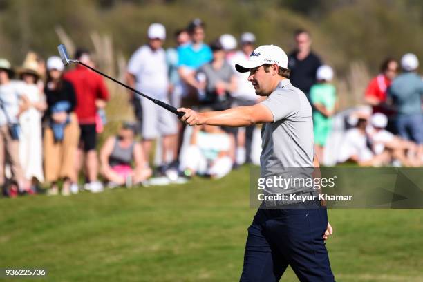 Peter Uihlein reacts and raises his putter after missing a putt on the 15th hole green during round one of the World Golf Championships-Dell...
