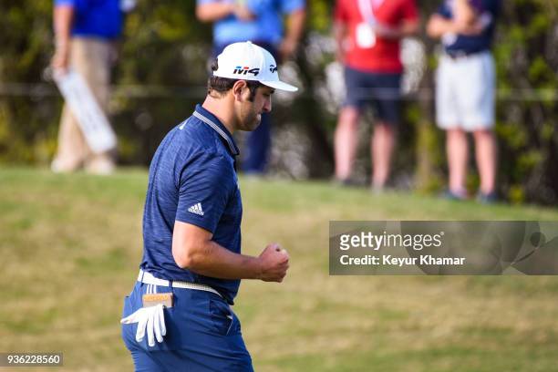 Jon Rahm of Spain celebrates and pumps his first after making a putt on the 16th hole green during round one of the World Golf Championships-Dell...