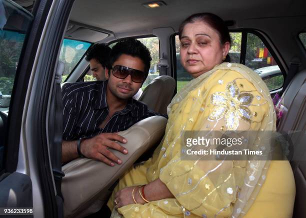 Virat Kohli, captain of Under -19 Cricket team, with his mother candidly poses for HT photographer during a visit to his school in New Delhi.