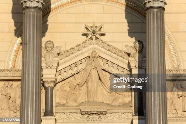 Virgin Mary with Adam and Eve. Ear-drum. Arcatures of the porch. Basilica of Notre-Dame de Fourvi�re. Lyon.
