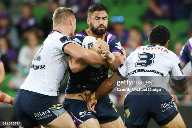 Jesse Bromwich of the Storm runs with the ball during the round three NRL match between the Melbourne Storm and the North Queensland Cowboys at AAMI...