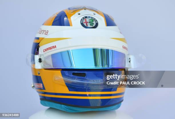 The helmet of Sauber's Swedish driver Marcus Ericsson is displayd ahead of the Formula One Australian Grand Prix in Melbourne on March 22, 2018. /...