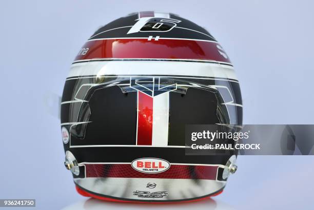 The helmet of Sauber's Monaco driver Charles Leclerc is displayd ahead of the Formula One Australian Grand Prix in Melbourne on March 22, 2018. /...