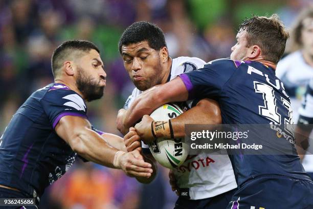 John Asiata of the Cowboys gets tackled by Jesse Bromwich of the Storm during the round three NRL match between the Melbourne Storm and the North...