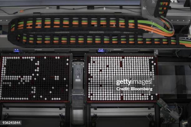 Trays containing vials of chemical research ingredients move through the substance library at the Bayer CropScience AG facility in Monheim, Germany,...