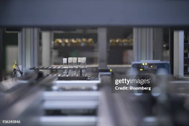 Tray containing vials of chemical research ingredients move through the substance library at the Bayer CropScience AG facility in Monheim, Germany,...