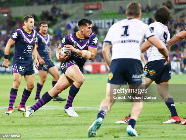 Nelson Asofa Solomona of the Storm runs with the ball on his way to a try during the round three NRL match between the Melbourne Storm and the North...