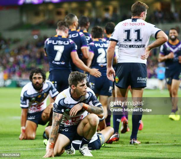 Cowboys players react after a try during the round three NRL match between the Melbourne Storm and the North Queensland Cowboys at AAMI Park on March...