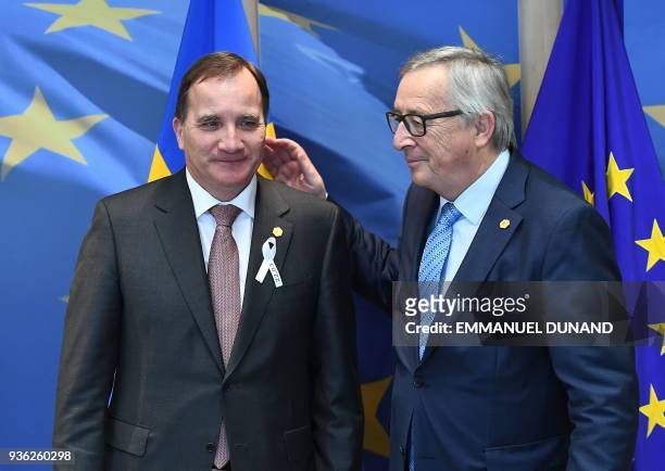 European Commission President Jean-Claude Juncker welcomes Sweden's Prime Minister Stefan Lofven ahead of an EU summit at the European Commission in...