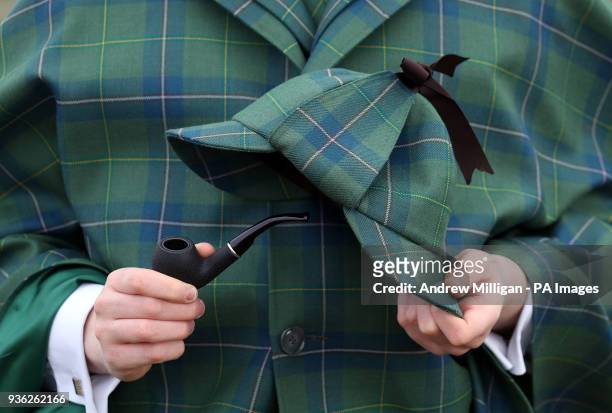 Harry Chamberlain holds a pipe and deerstalker hat at the launch in Edinburgh of the Sherlock Holmes tartan which has been designed by the great...