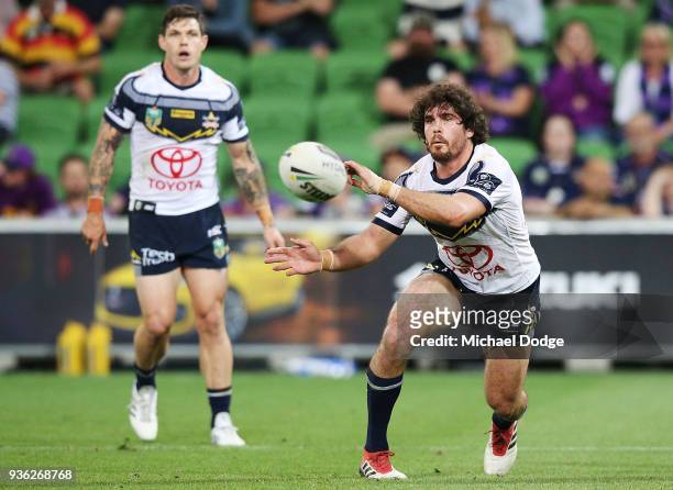 Antonio Winterstein of the Cowboys passes the ball during the round three NRL match between the Melbourne Storm and the North Queensland Cowboys at...