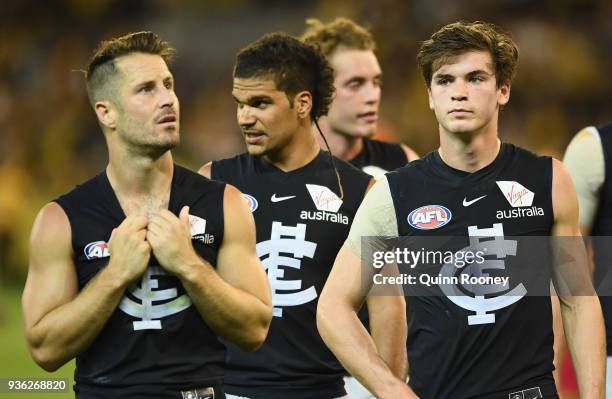 Matthew Wright and Paddy Dow of the Blues look dejected after losing the round one AFL match between the Richmond Tigers and the Carlton Blues at...