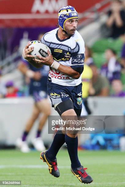 Johnathan Thurston of the Cowboys accepts a pass during the round three NRL match between the Melbourne Storm and the North Queensland Cowboys at...