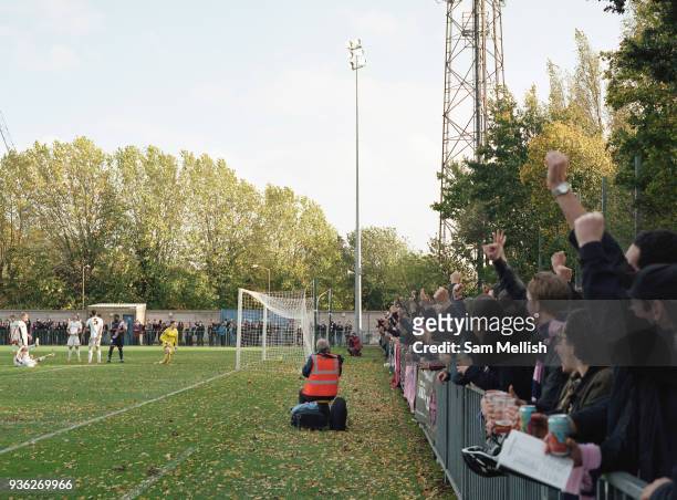 Fans cheer as DHFC score a goal during Dulwich Hamlet FC vs Burgess Hill Town F.C. At Champion Hill on 21st October 2017 in South London in the...