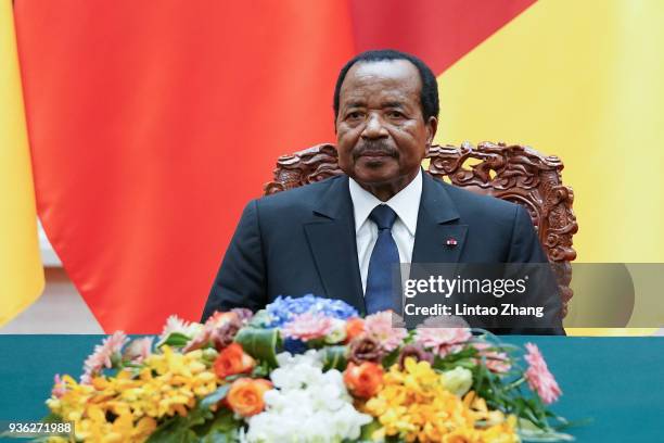 President of Cameroon Paul Biya with Chinese President Xi Jinping attend a signing ceremony at The Great Hall Of The People on March 22, 2018 in...
