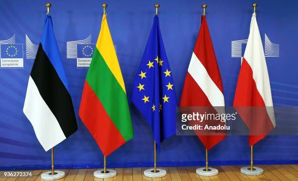 Flags of European Union, Lithuania, Latvia, Estonia and Poland are seen in front of the VIP entrance of European Commission building ahead of the EU...