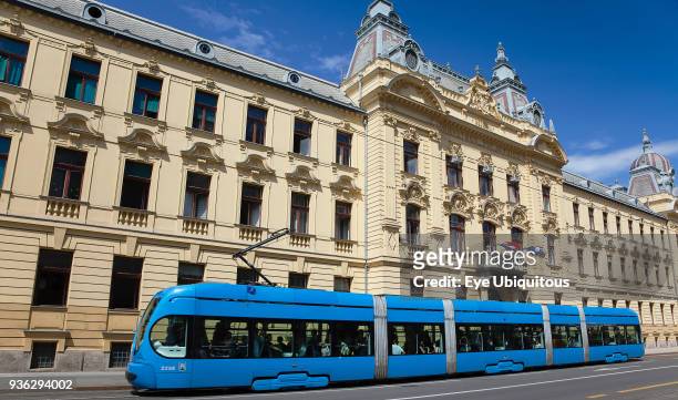 Croatia, Zagreb, Old town, Mihanoviceva Street, Hz Vuca Vlakova national railway headquarters with tram apssing by.
