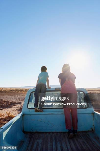 usa, arizona, mother with boy (6-7) looking at view from pick-up truck - pick up truck back stock pictures, royalty-free photos & images