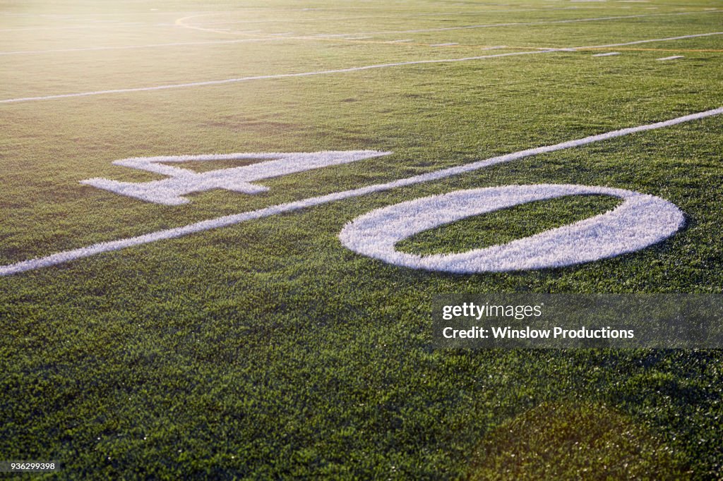 Forty yard line on green playing field