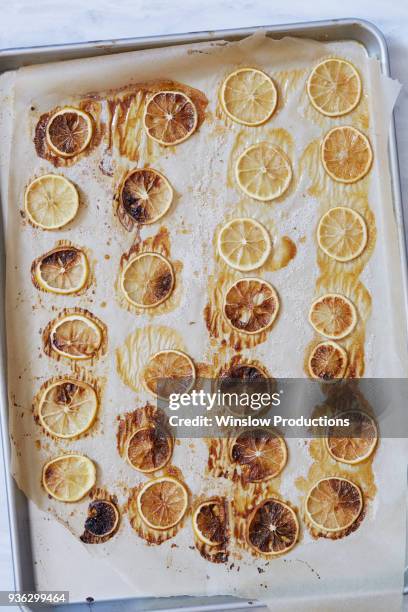 directly above view of caramelized lemons - backblech stock-fotos und bilder