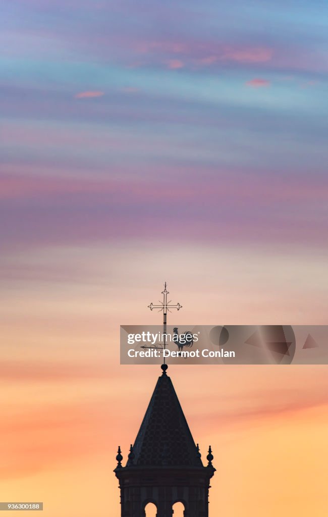 Spain, Andalusia, Seville, Weathercock on top of tower at sunset