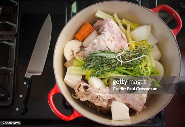 turkey leftovers and vegetables in pot on stove - bouquet garni stock pictures, royalty-free photos & images