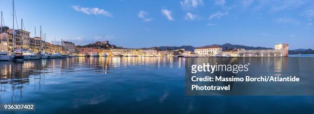 the port and the village at twilight - portoferraio stock pictures, royalty-free photos & images