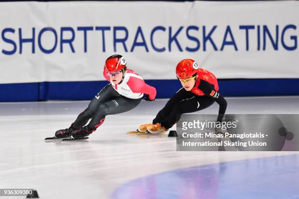 Kim Boutin of Canada skates ahead of Jinyu Li of China as they compete in the women's 1000 meter quarterfinal during the World Short Track Speed...