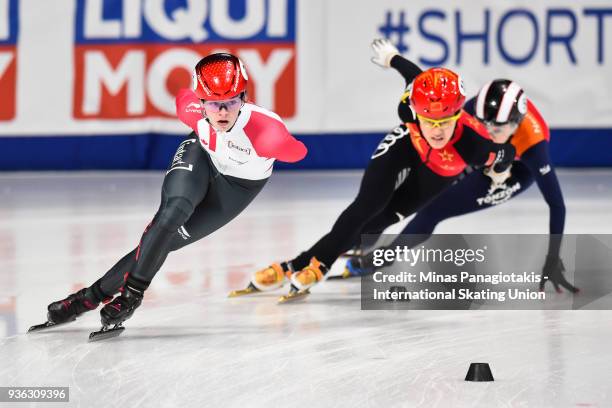 Kim Boutin of Canada skates ahead of Jinyu Li of China as they compete in the women's 1000 meter quarterfinal during the World Short Track Speed...