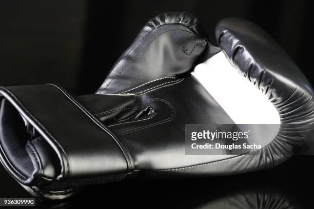 mma boxing glove on a black background - muscle black wallpaper stock pictures, royalty-free photos & images
