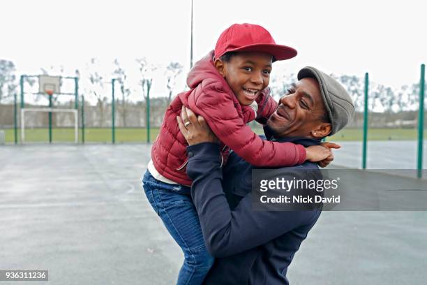 father and son (4-5) playing in park - community stock pictures, royalty-free photos & images