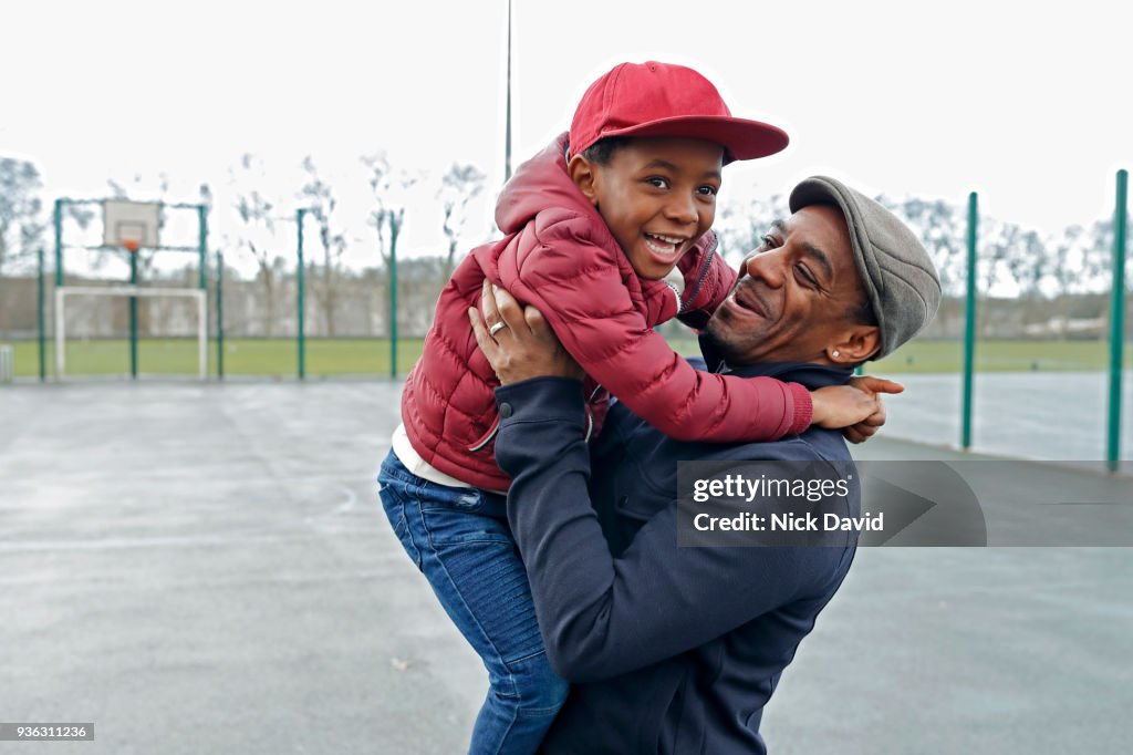Father and son (4-5) playing in park