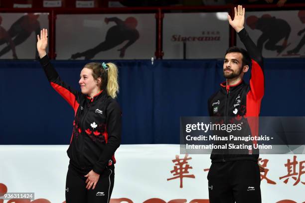 Marianne St-Gelais and Francois Hamelin of Canada salute the fans as they announce their retirement during the World Short Track Speed Skating...