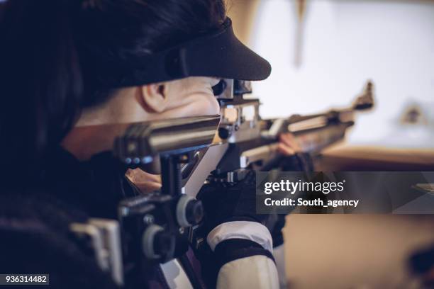 girl sport shooter training - target sport stock pictures, royalty-free photos & images