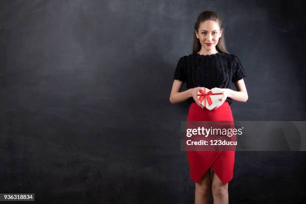 beautiful young woman holding gift box - 123ducu stock pictures, royalty-free photos & images