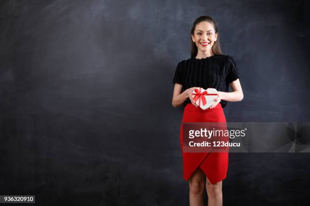 beautiful young woman holding gift box - 123ducu stock pictures, royalty-free photos & images