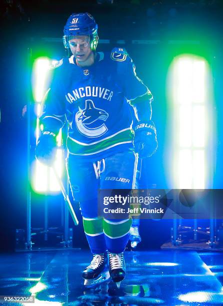 Troy Stecher of the Vancouver Canucks walks to the ice during their NHL game against the San Jose Sharks at Rogers Arena March 17, 2018 in Vancouver,...