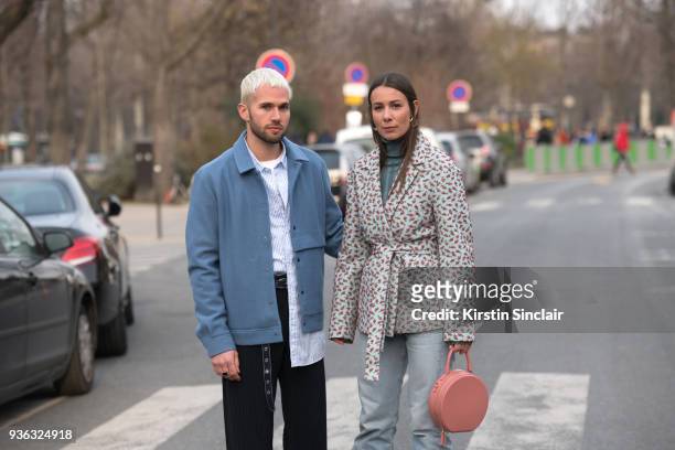 Fashion blogger JS Roques wears a Cos jacket, Uniqlo shirt, Issey Miyake trousers with Fashion blogger Alice Barbier wearing a Rochas jacket, Mansur...