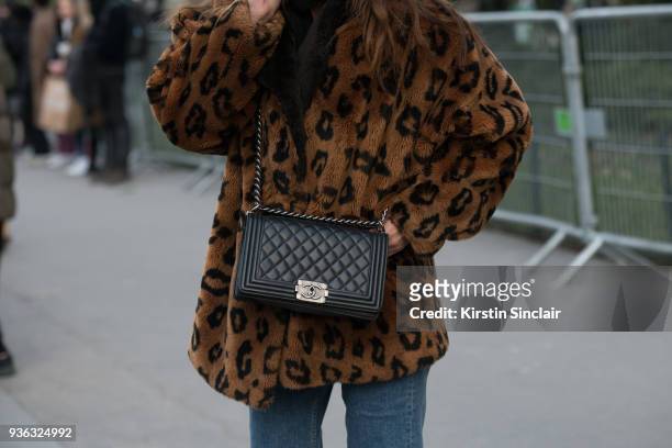 Fashion blogger Sofya Benzakour wears a Chanel bag and a vintage jacket day 3 of Paris Womens Fashion Week Spring/Summer 2018, on February 28, 2018...