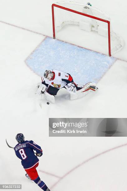 Mike Condon of the Ottawa Senators stops a shot by Zach Werenski of the Columbus Blue Jackets during the game on March 17, 2018 at Nationwide Arena...