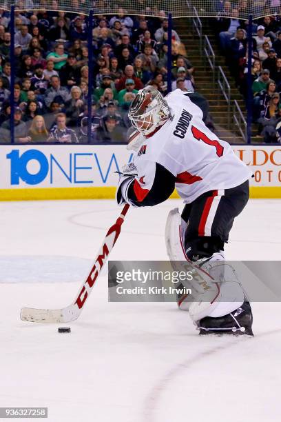 Mike Condon of the Ottawa Senators controls the puck during the game against the Columbus Blue Jackets on March 17, 2018 at Nationwide Arena in...