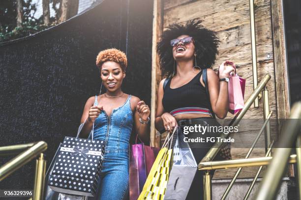 young friends having shopping together - girl after shopping stock pictures, royalty-free photos & images