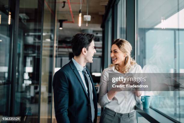 colleagues and friends - happy couple flirt stock pictures, royalty-free photos & images