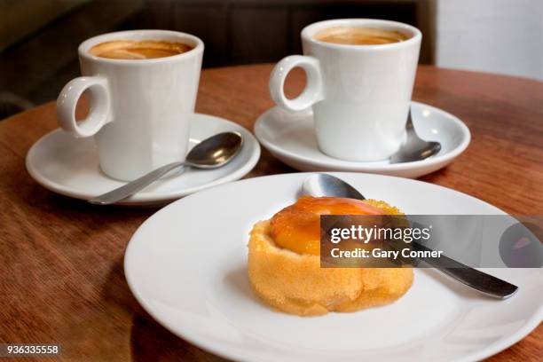 coffee and pastry, cafe con leche and pionono pastry - leche stock pictures, royalty-free photos & images