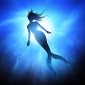 Swimming Mermaid Under The Waves