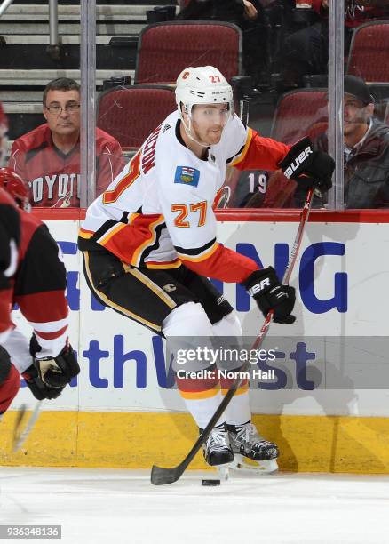 Dougie Hamilton of the Calgary Flames skates with the puck against the Arizona Coyotes at Gila River Arena on March 19, 2018 in Glendale, Arizona.