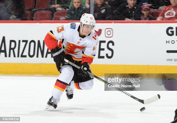 Johnny Gaudreau of the Calgary Flames skates with the puck against the Arizona Coyotes at Gila River Arena on March 19, 2018 in Glendale, Arizona.