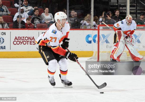 Dougie Hamilton of the Calgary Flames skates with the puck against the Arizona Coyotes at Gila River Arena on March 19, 2018 in Glendale, Arizona.