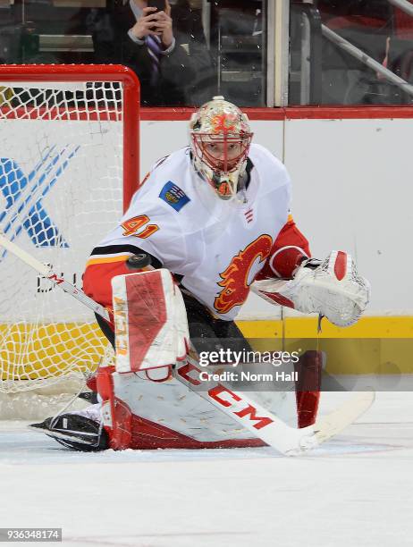 Mike Smith of the Calgary Flames gets ready to make a save against the Arizona Coyotes at Gila River Arena on March 19, 2018 in Glendale, Arizona.