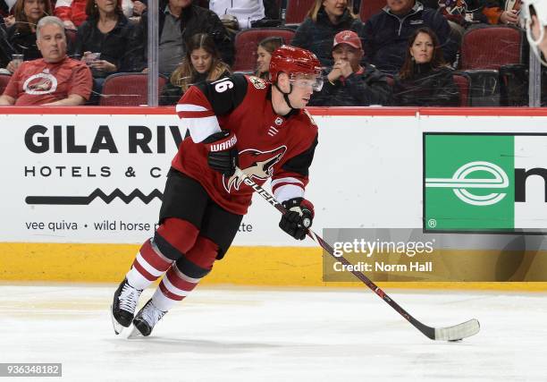 Max Domi of the Arizona Coyotes skates with the puck against the Calgary Flames at Gila River Arena on March 19, 2018 in Glendale, Arizona.